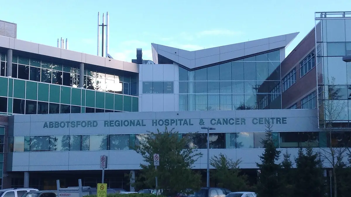 The front of Abbotsford Regional Hospital and Cancer Centre, with its name across the facade, in Abbotsford, British Columbia