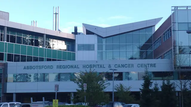 The front of Abbotsford Regional Hospital and Cancer Centre, with its name across the facade, in Abbotsford, British Columbia