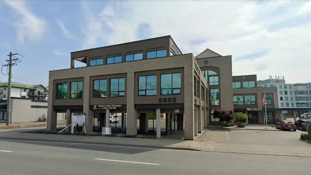 Front exterior of Abbotsford UPCC in Abbotsford, British Columbia, a brick building showing 2692 and the urgent and primary care centre sign