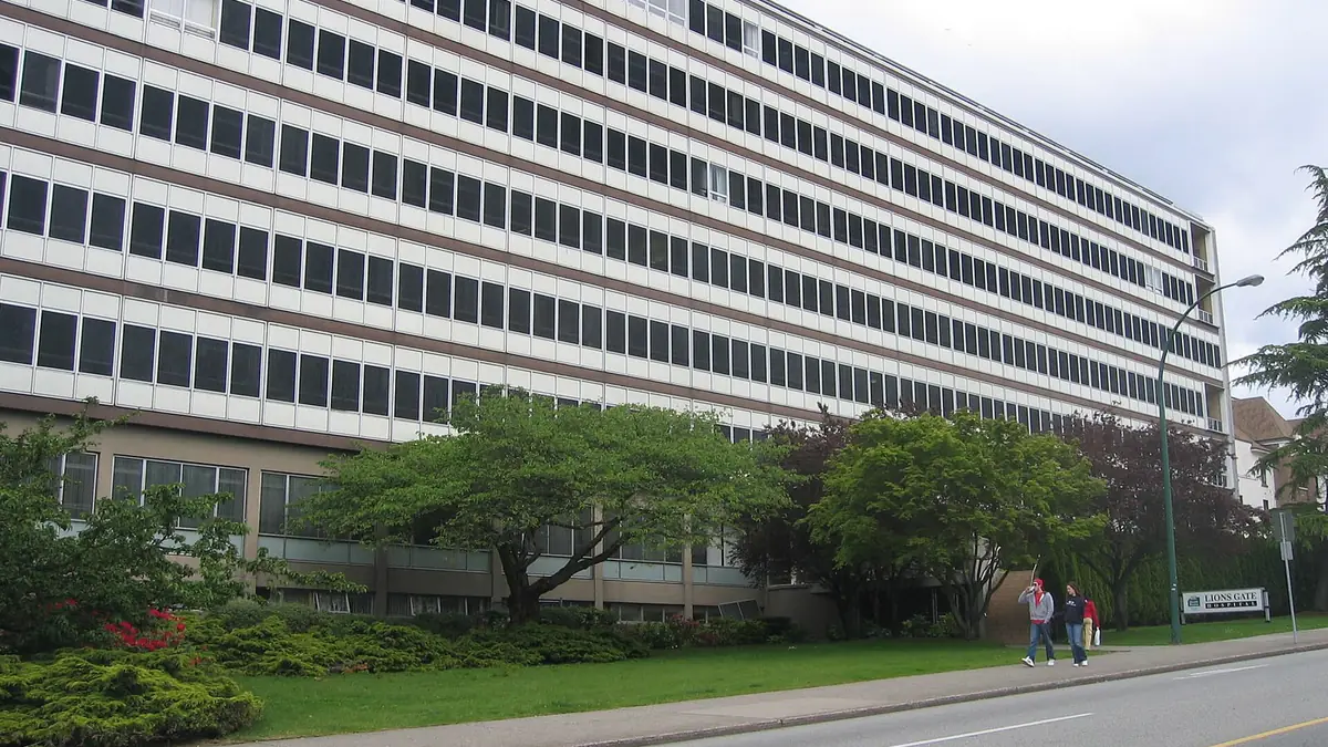 A tower of Lions Gate Hospital and its street sign in North Vancouver, British Columbia