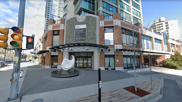 The entrance of Metrotown UPCC in Burnaby, British Columbia, with the urgent and primary care centre canopy sign