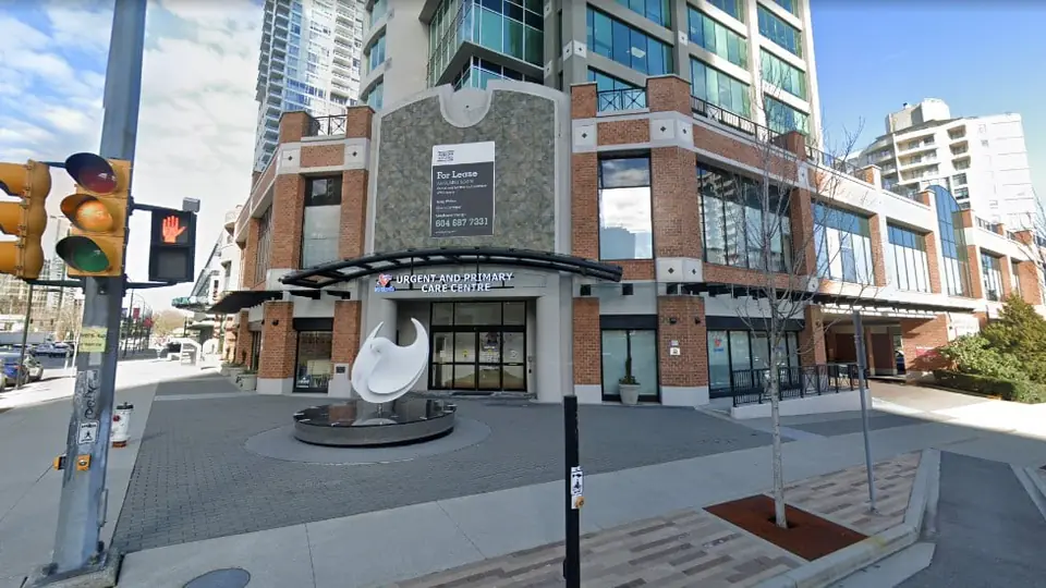 The entrance of Metrotown UPCC in Burnaby, British Columbia, with the urgent and primary care centre canopy sign