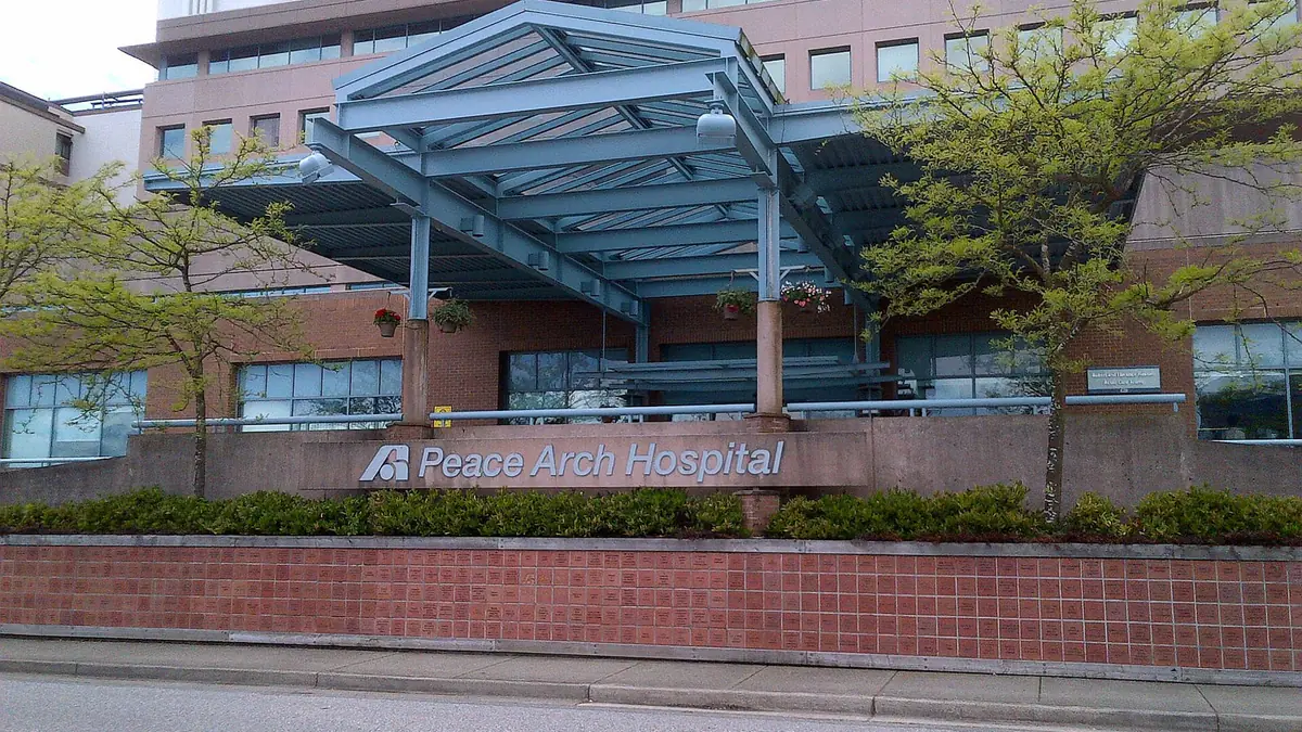 The main entrance canopy and sign of Peace Arch Hospital in White Rock, British Columbia
