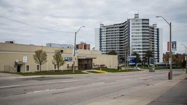 The West End Urgent Care Centre in Hamilton, Ontario, with the pharmacy and urgent care signs